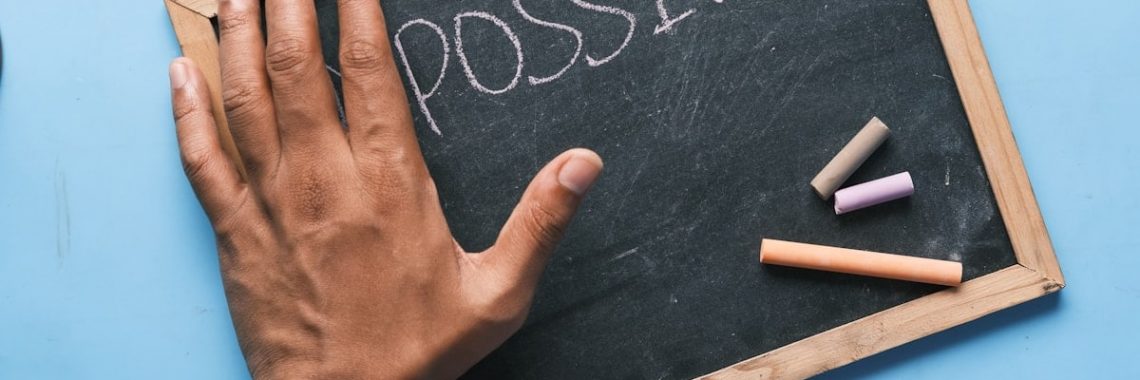 a chalkboard with the word possible written on it